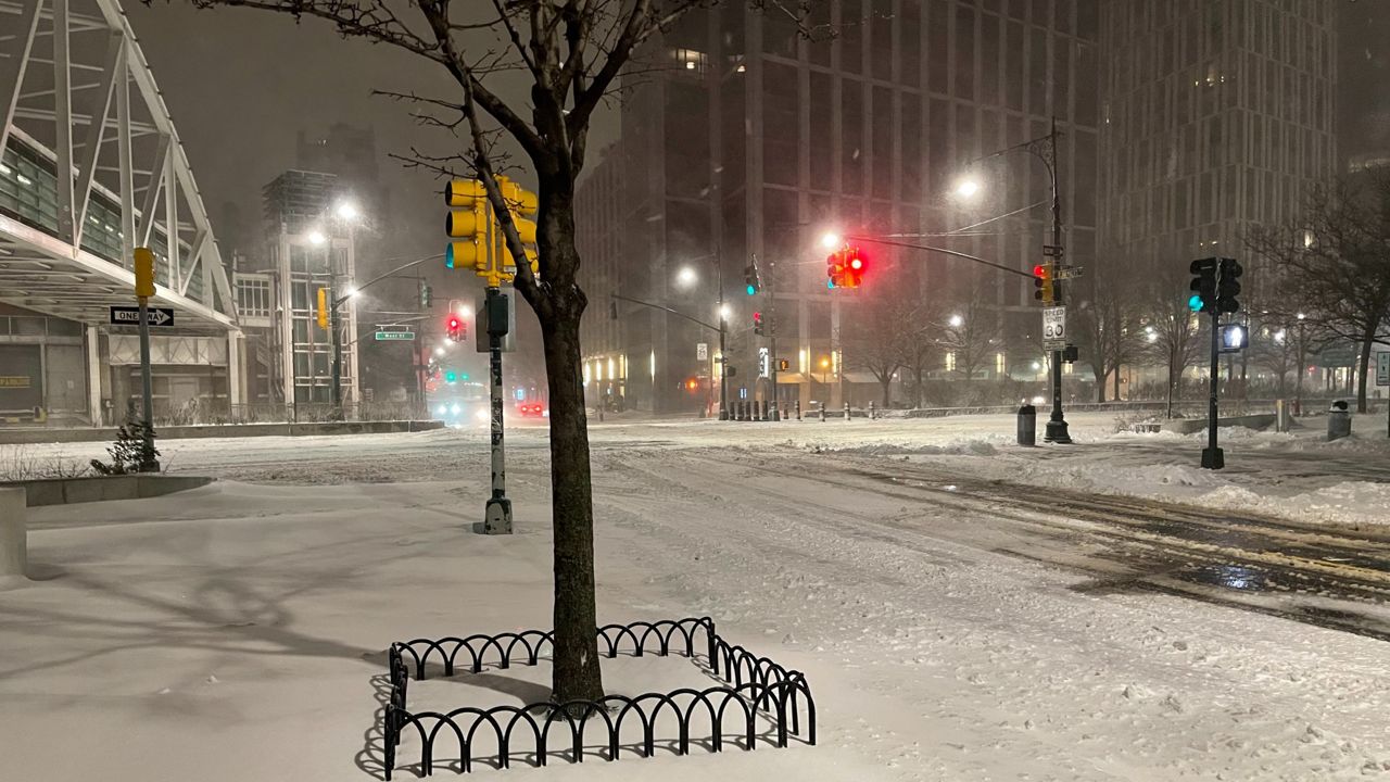 How many inches of snow in NYC on Tuesday?