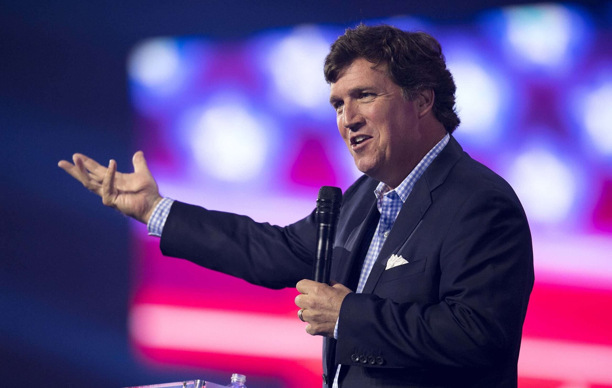 What will Tucker Carlson say at AmericaFest on December 18?
